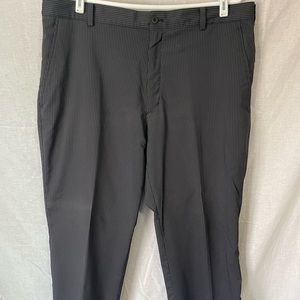 Nike dry fit golf pants flat front.